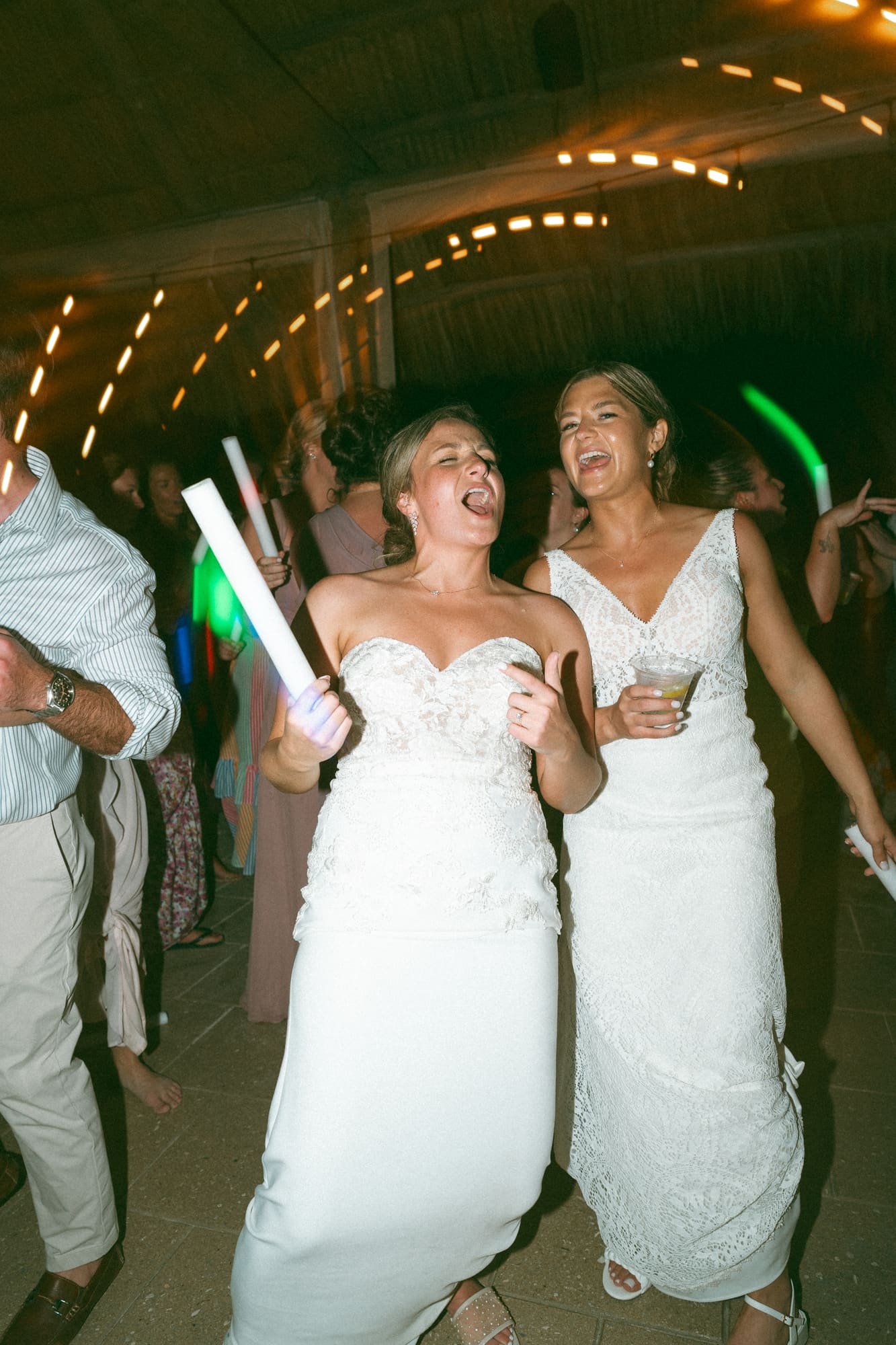 Brides singing into a foam stick microphone